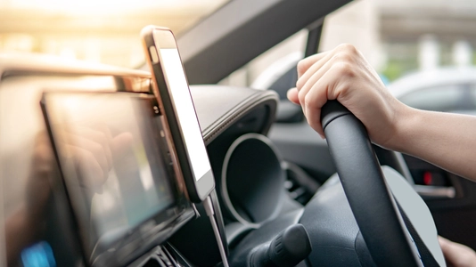 hand holding steering wheel