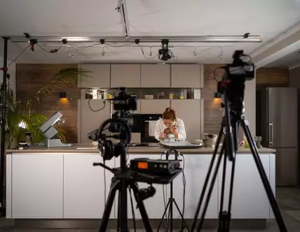 Female cook preparing cookies in the kitchen