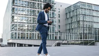 young professional looking at mobile phone