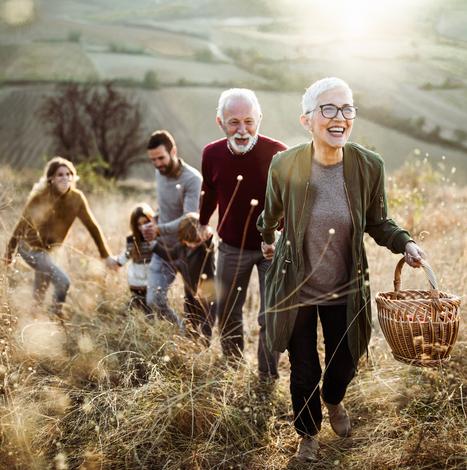 older couple with family walking up hill