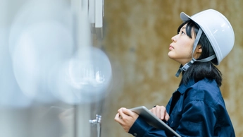 Young female engineer working at engineering facility