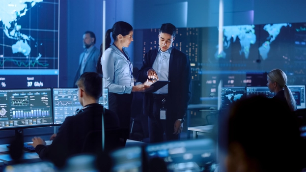 Project Manager and Engineer Talking while Using A Digital Tablet Computer