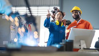 manufacturing colleagues discussing work