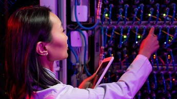 woman working on server machine