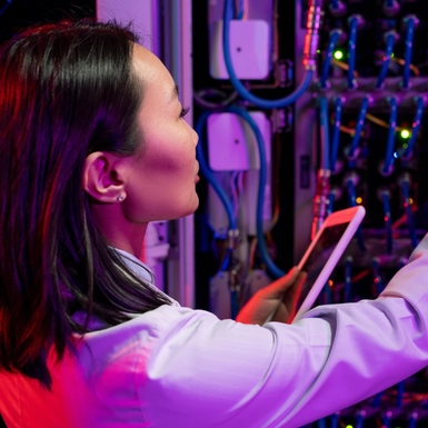 woman working on server machine