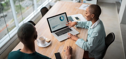 Financial advisor or real estate agent talking to customer at home