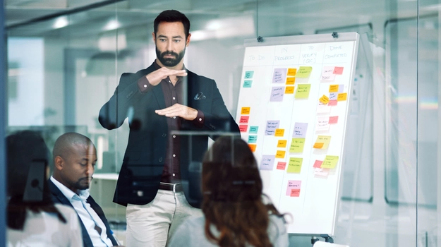 Shot of a businessman delivering a presentation to his team