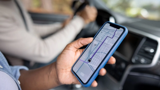 hand holding GPS on mobile device