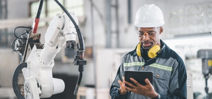 man working in manufacturing plant in safety gear