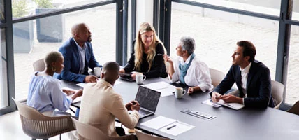 Diverse group of businesspeople talking during a meeting in an office boardroom