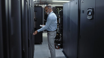 man working in a server room