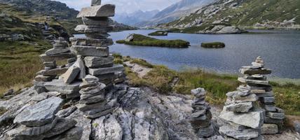 cairns made by hikers near laghetto moesola at san