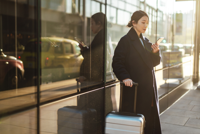 woman looking at mobile phone