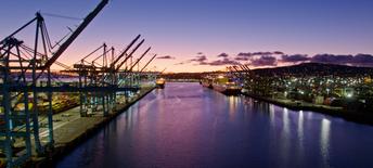 shipping boats at dock with sunset background
