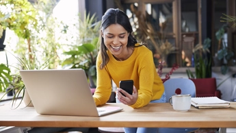 Women is using phone while working