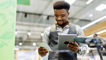 man reviewing something on tablet