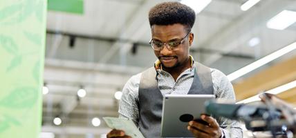 man reviewing something on tablet