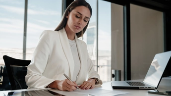 businesswoman signing an official document