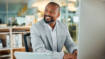 Man is happy and planning for weekend in office at night