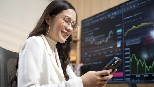 Woman using smartphone to buy cryptocurrency, blockchain investment, decentralization and stock market concept 