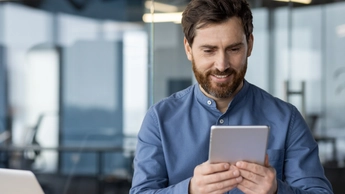 Man is using tablet in office