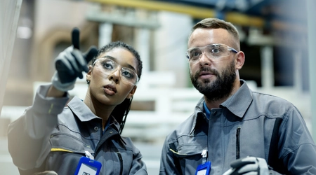 The girl is explaining something to her colleagues