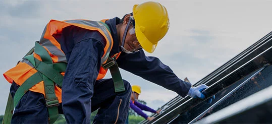 Professional worker wearing safety uniforms working at high place