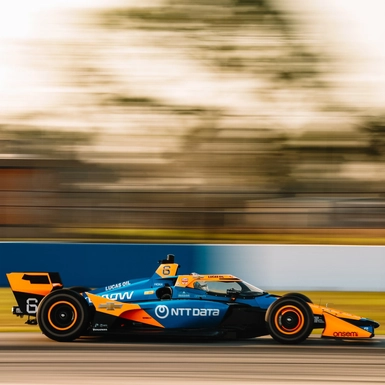 Man driving formula racing car