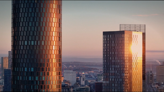 City buildings lit by sun