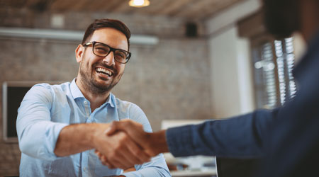 Close up of handshake in the office