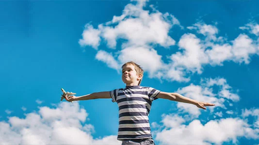 Boy plays the pilot of the aircraft