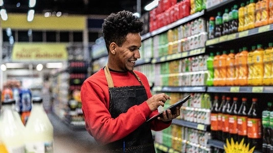 man working in store on tablet