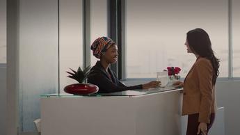 female executive at office reception counter