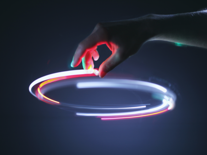 hand swirling colored lights