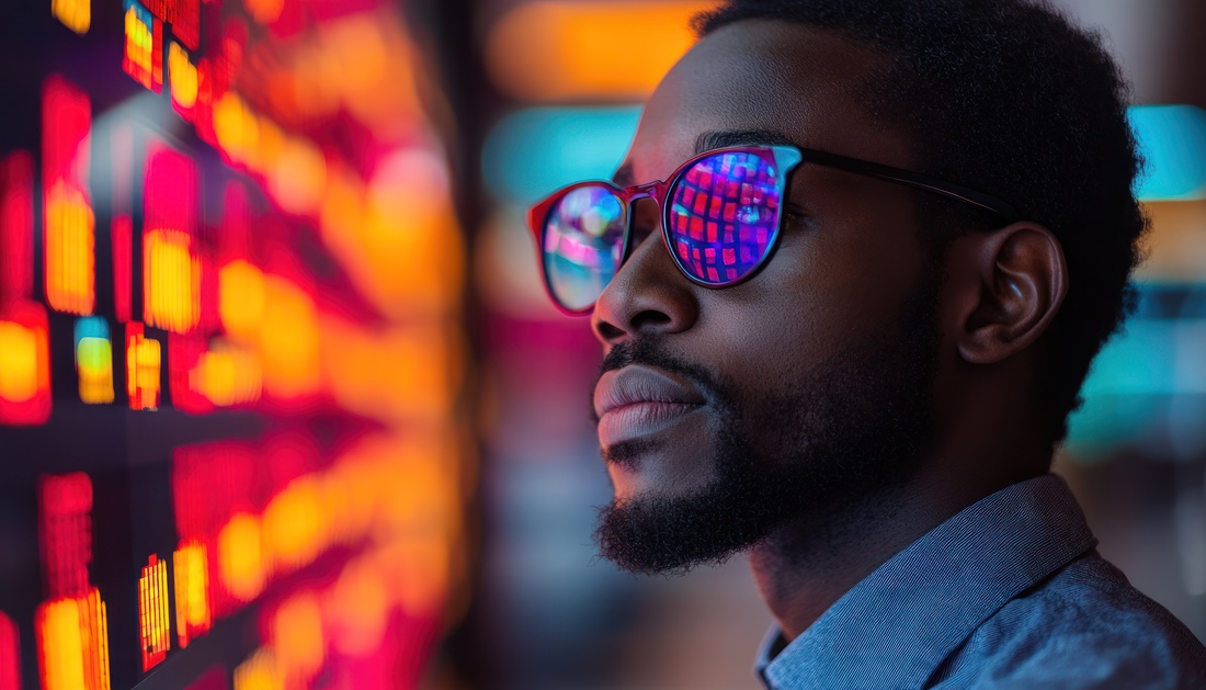 Man Observing Colorful Digital Data Display