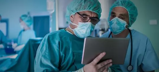 doctors reviewing reports on ipad