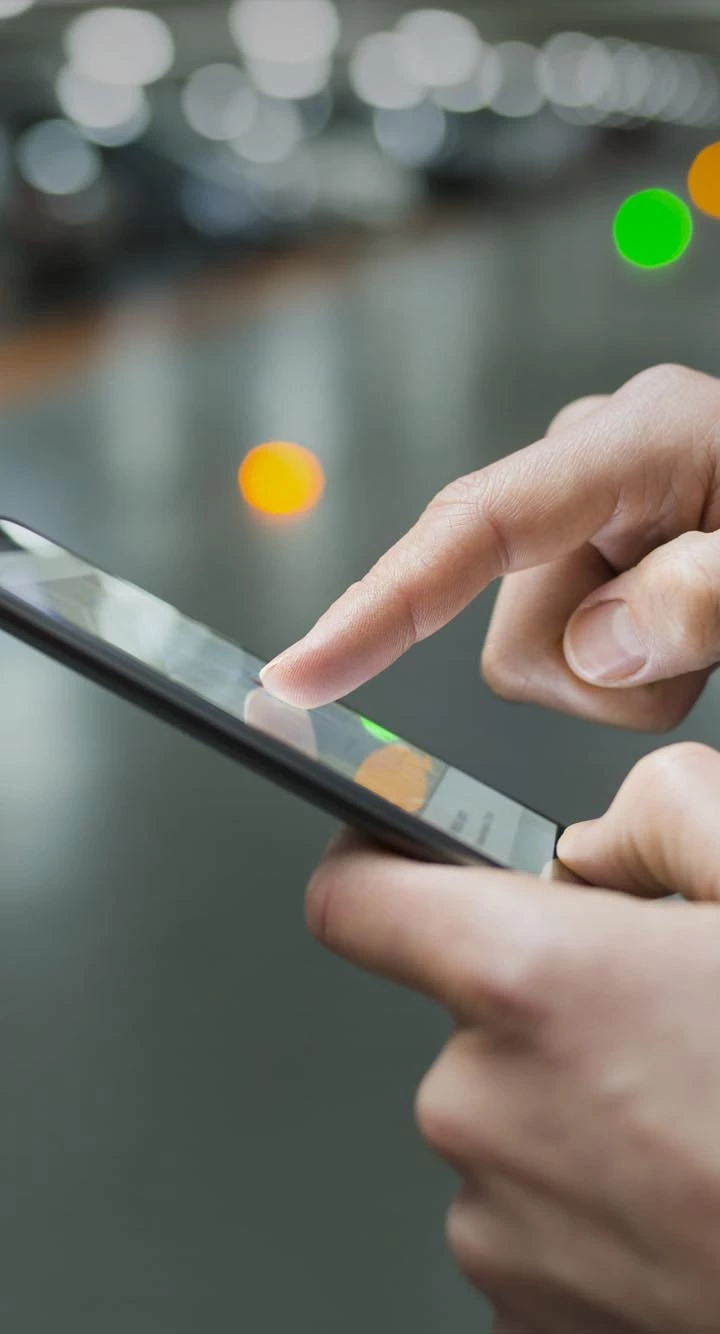 person checking his mobile only his hands appear