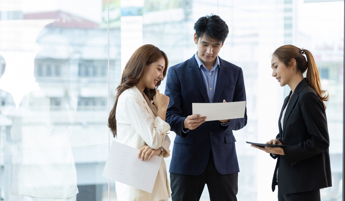 Collaboration of people in the organization. Colleague or business partner discussing plans to work on a project together.
