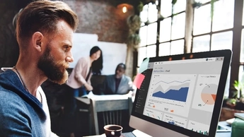 man in office working at desk