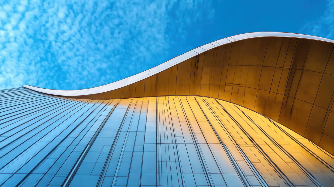 Elegant and abstract modern building exterior against blue sky 