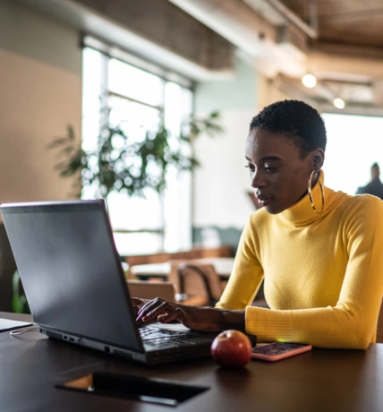 Young businesswoman working with laptop at coworking