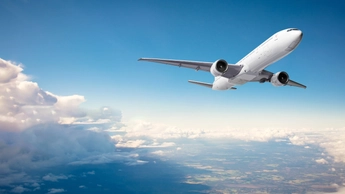 airplane in sky with clouds