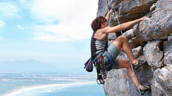 woman rock climbing