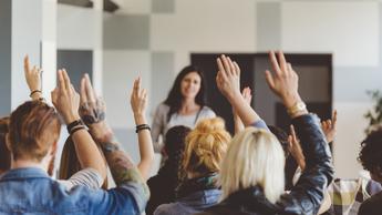 group raising hands