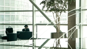 man sitting in chair in building