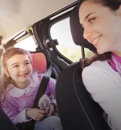 Girl in the car with her mother