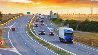 a truck that is driving down the highway