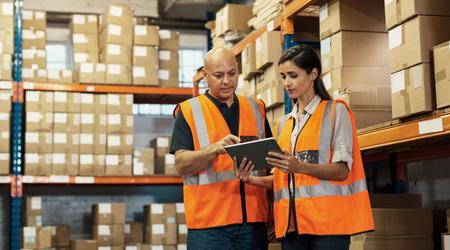 Logistics, warehouse manager and woman with tablet stock inventory, storage boxes and factory engineer.