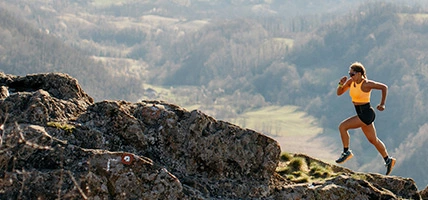 Woman running on mountain